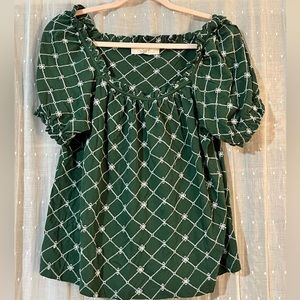 100% Cotton green blouse with white embroidery.